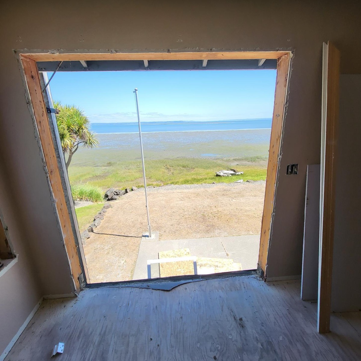 Framed opening with waterfront view on a new build